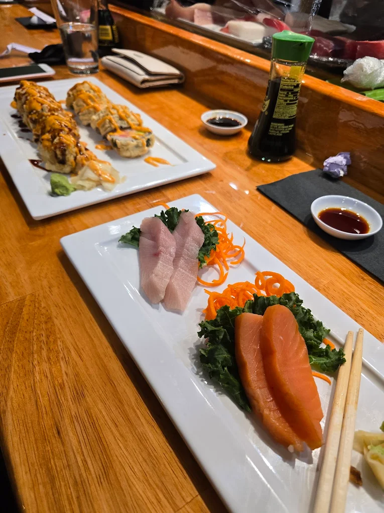 Sashimi and sushi platter with condiments at Otaka Sushi & Grill, a Asian Fusion Restaurant in Manchester
